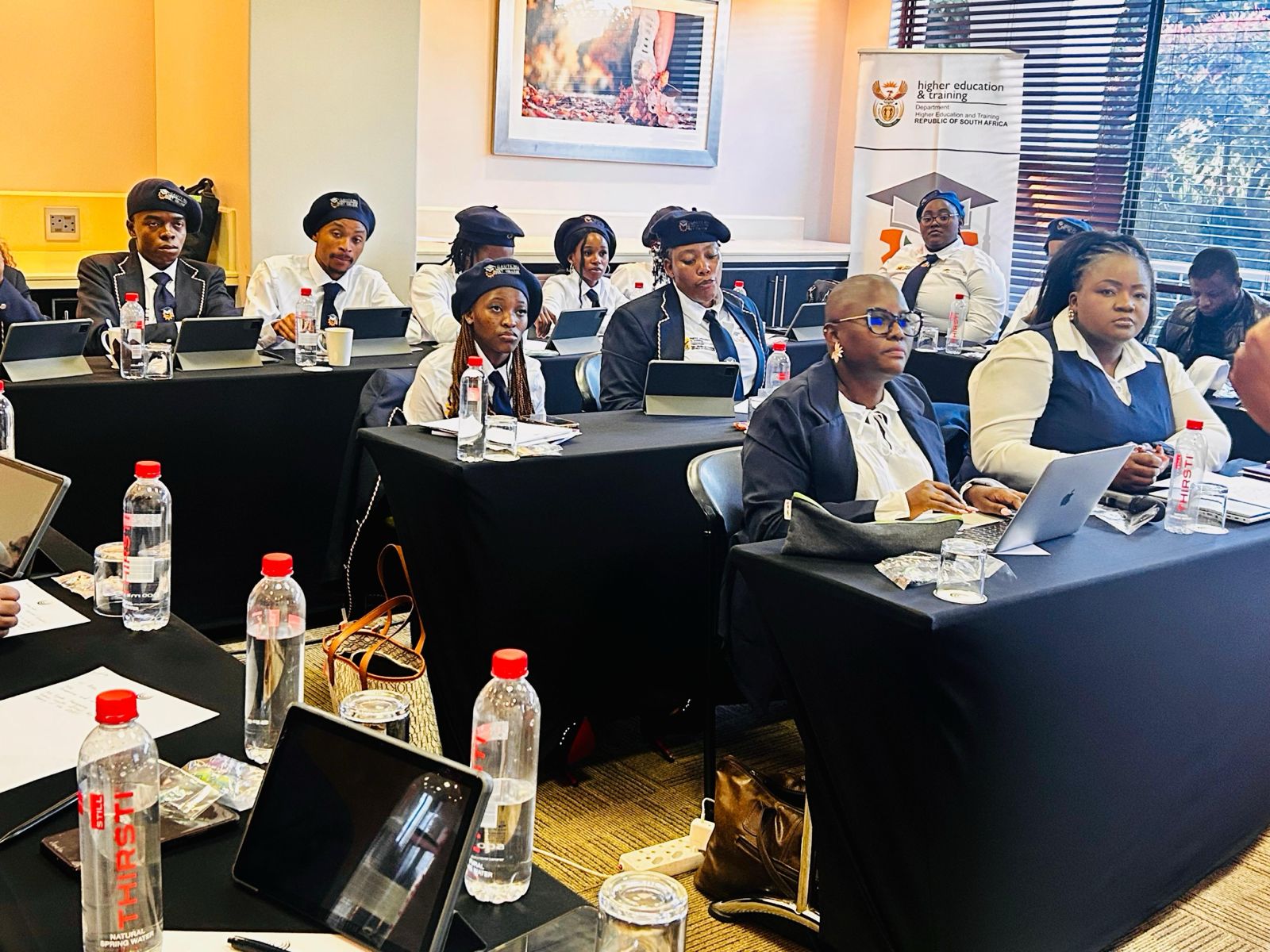 Conference session — students engaged in formal learning with DHET partners