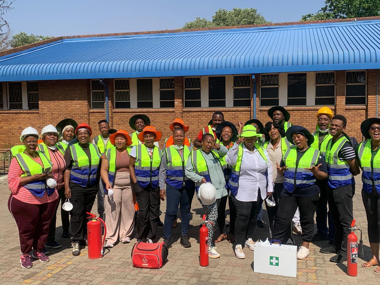 Occupational health and safety training — hi-vis, hard hats, fire extinguishers and first-aid kit